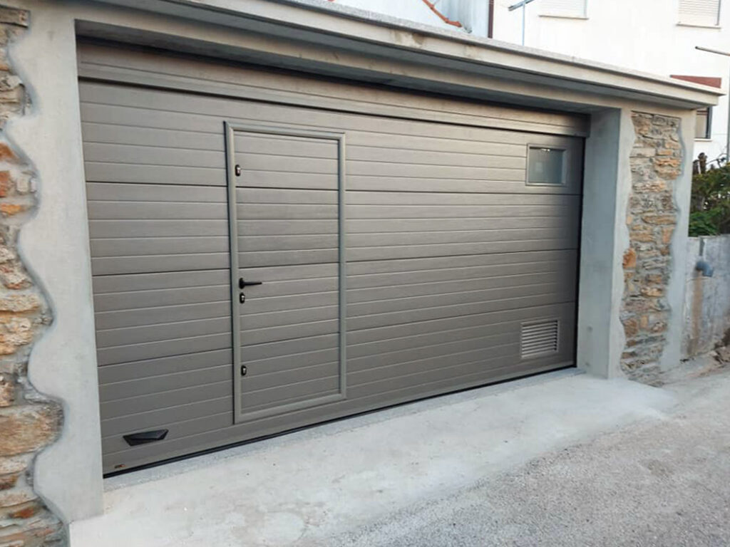 Folding garage door painted metalic RAL 9007 aluminium colour