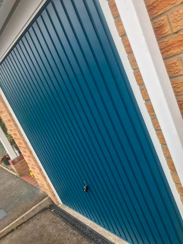 Garage door painted RAL 5020 ocean blue